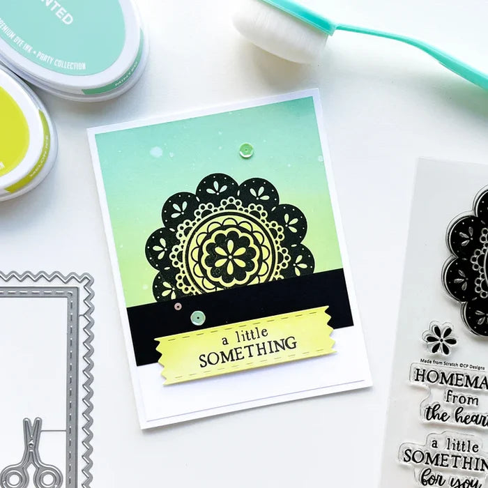 Catherine Pooler - Dies - A Cut Above. The A Cut Above Dies is a pinking cut edge frame die with layers and a little sewn tag die. The tiny snips are just the cutest addition! Available at Embellish Away located in Bowmanville Ontario Canada. Eaxample by brand ambassador.
