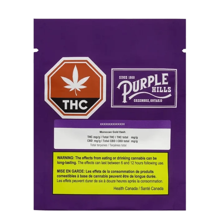 Moroccan Gold Hash packaging features a purple and gold label with a cannabis leaf design, set against a dark background.