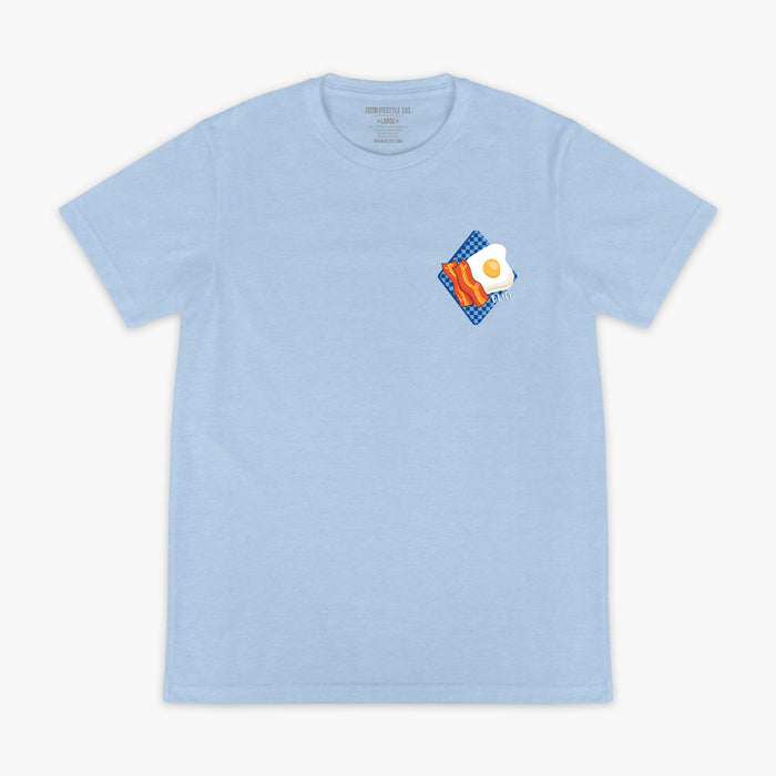 Light blue t-shirt with a graphic of bacon and an egg on a white background
