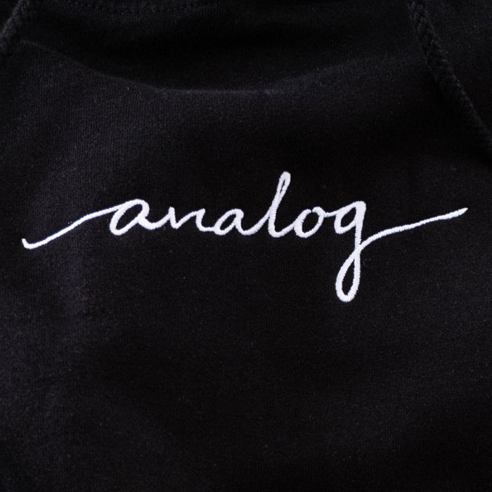 black hoodie with white "analog" cursive text