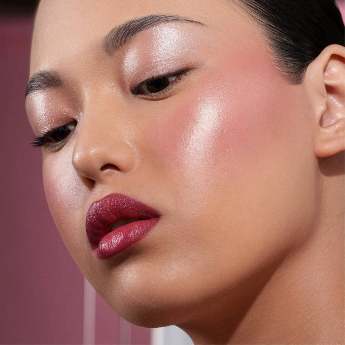 Berry Pop Cheek Trio model look on a dark pink background.