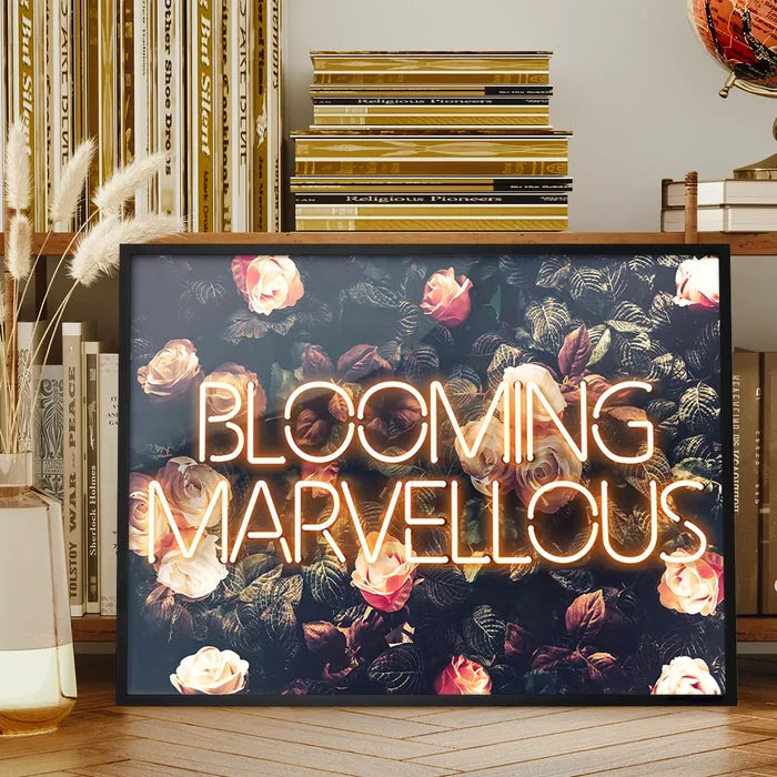 Blooming Mavellous Neon Print framed on a living room bookshelf