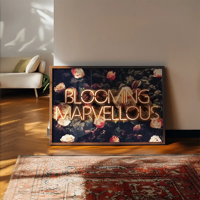 Blooming Mavellous Neon Print framed, leaning on a wooden floor beside a rug