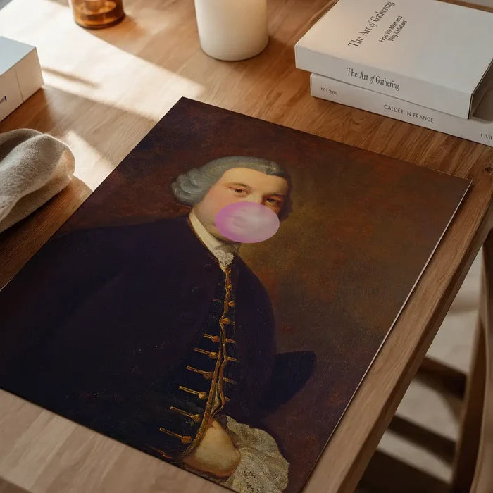 Bubblegum Gent Print, quirky altered art print unframed on a home office desk