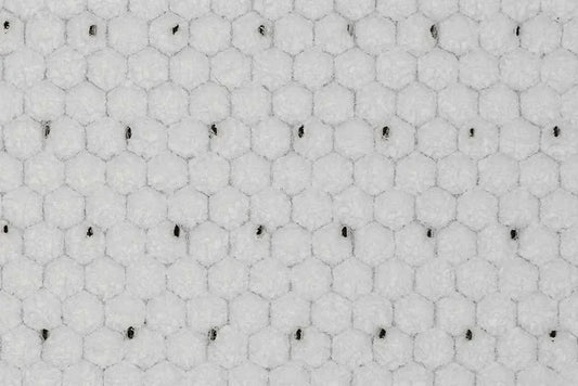 White colored mat that has a honeycomb look with small holes in it. Used with polyester, vinyl ester and epoxy resins.