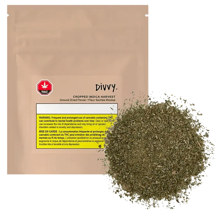 Close-up of the Cropped Harvest (Indica) packaging with a warning label against prolonged use, set against a dark background.