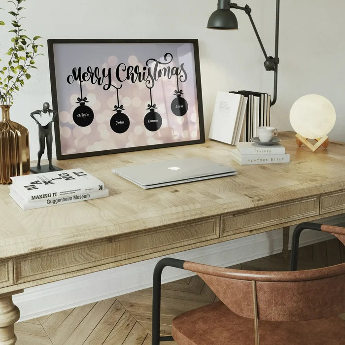 Custom Merry Christmas print in a black frame featuring four personalized baubles on a bokeh background.