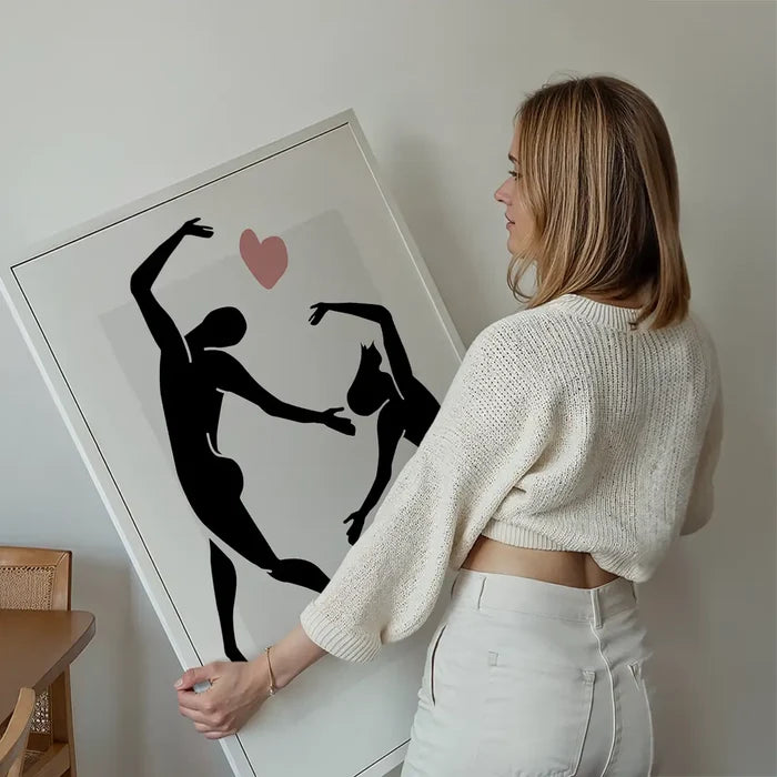 Dancers Black And White Painting Print held up against a living room wall