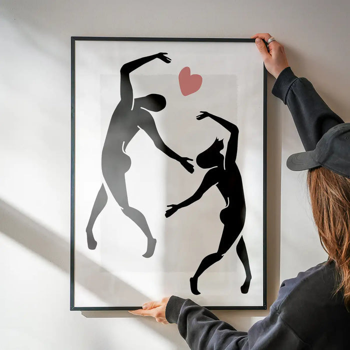 Dancers Black And White Painting Print being hung on a wall in a black frame