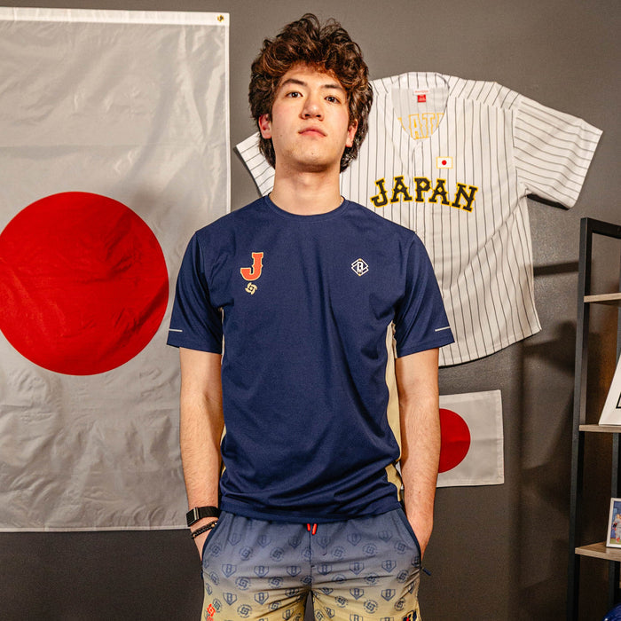 Adult model wearing navy Diamond Tech Vented Japan graphic tee