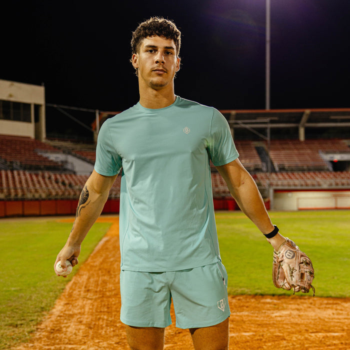 Adult model wearing blue Diamond Tech Vented Teal graphic tee