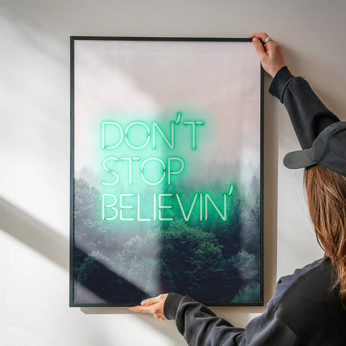 Dont Stop Believing Lyrics Neon Print being hung on a wall in a black frame
