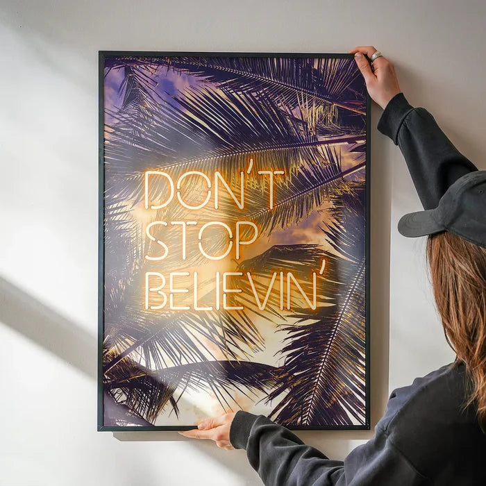Dont Stop Believing Lyrics Neon Tropical Print being hung on a wall in a black frame
