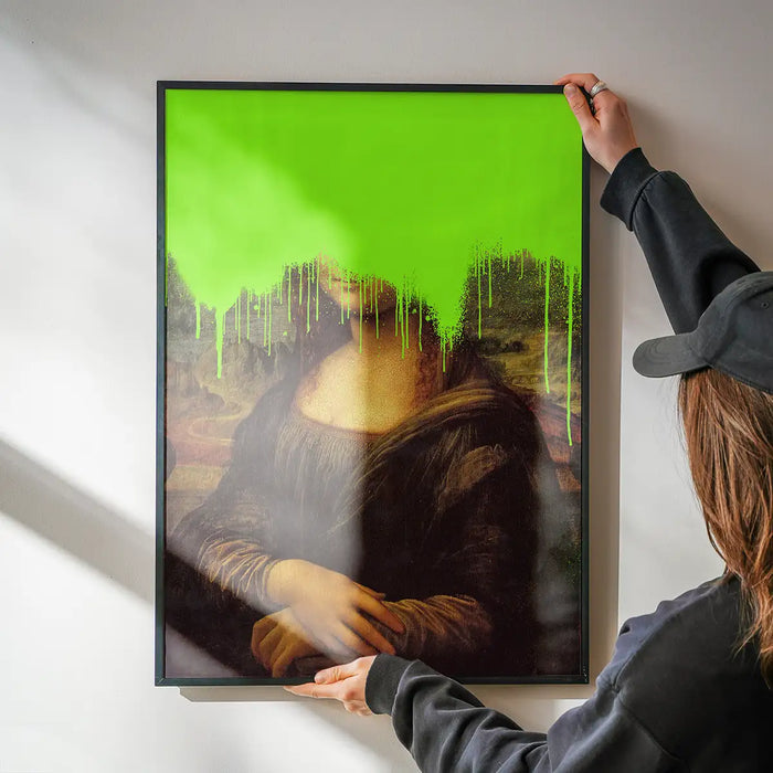 Drippy Mona Lisa Graffiti Print being hung on a wall in a black frame