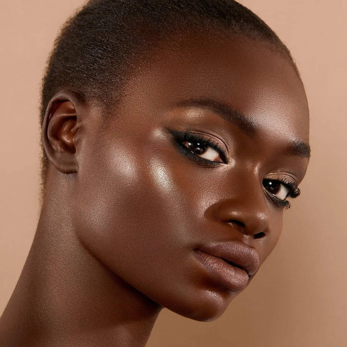 Face Glow Cream Shimmer model look on a light background.