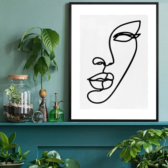 Face Study Line Art Print black framed on a living room shelf