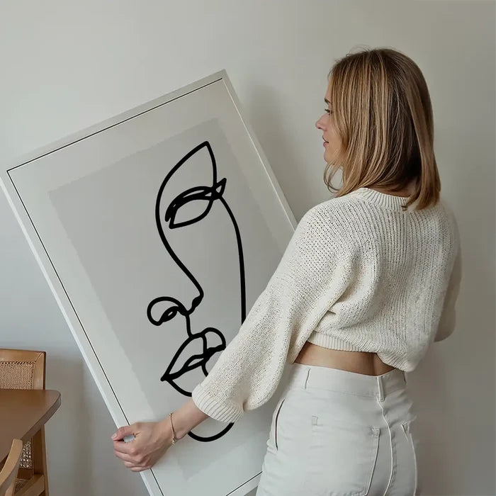 Face Study Line Art Print held up against a living room wall