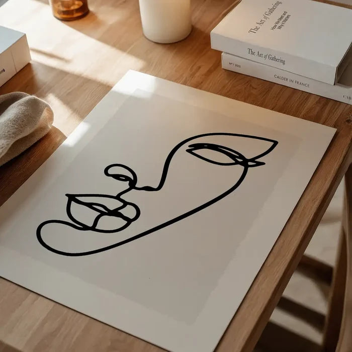 Face Study Line Art Print unframed on a home office desk