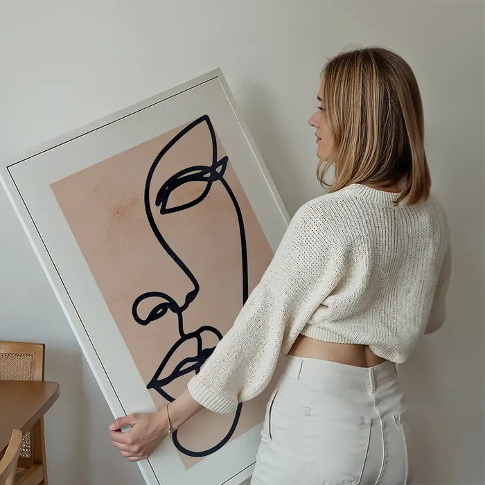 Face Study Line Art Watercolour Print held up against a living room wall