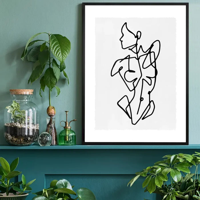 Female Front Study Line Art Print black framed on a living room shelf
