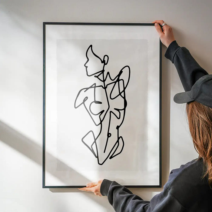Female Front Study Line Art Print being hung on a wall in a black frame