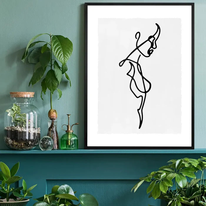 Female Side Study Line Art Print black framed on a living room shelf