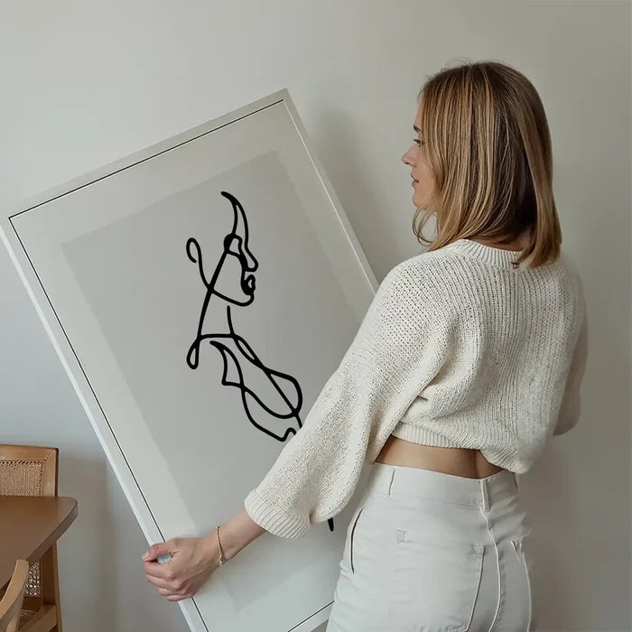 Female Side Study Line Art Print held up against a living room wall