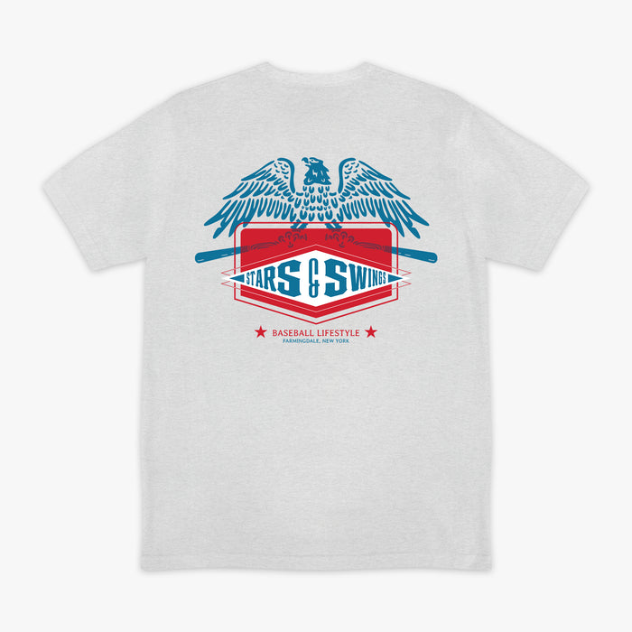Heather gray short sleeve tee with blue spread-wing eagle above Stars and Swings badge graphic with crossed bats and Baseball Lifestyle Farmingdale New York text on white background