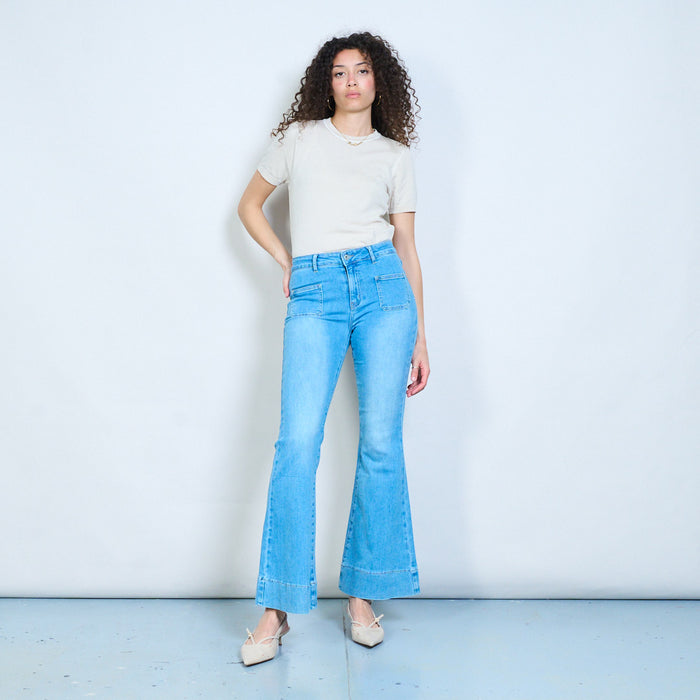 Front patch pocket flare-leg denim jeans with structured hem panel wholesale