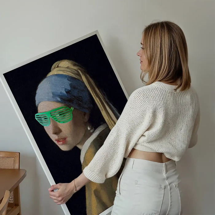 Girl With Green Shutter Shades Print held up against a living room wall