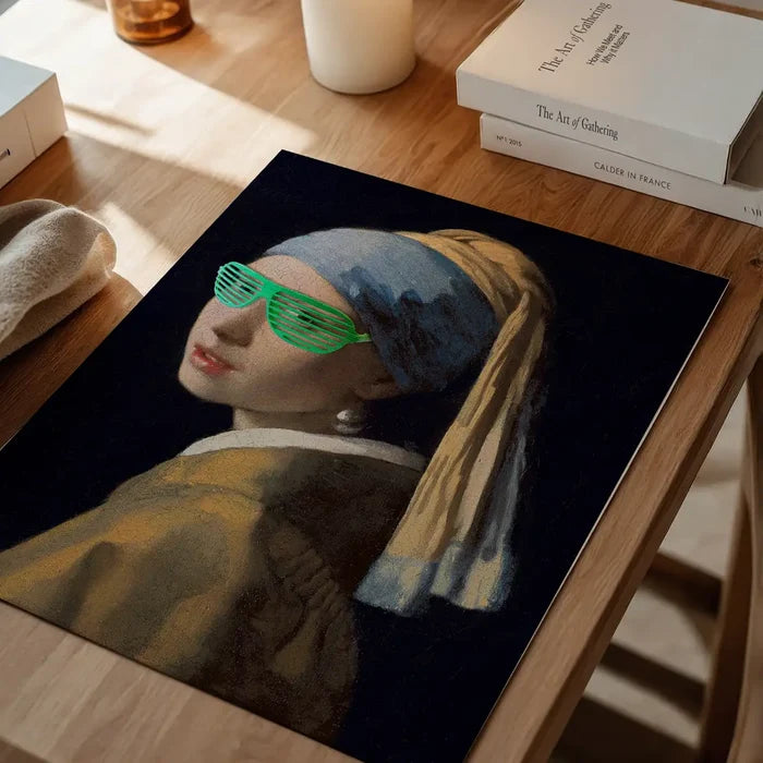 Girl With Green Shutter Shades Print, quirky altered art print unframed on a home office desk