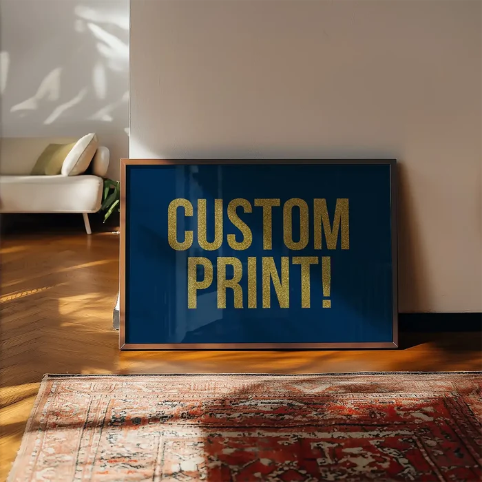 Gold Glitter Personalised Text Print framed, leaning on a wooden floor beside a rug