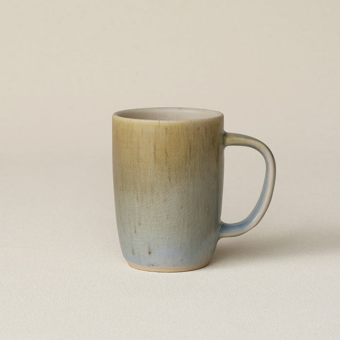 Hand-thrown ceramic mug by Rookwood Pottery