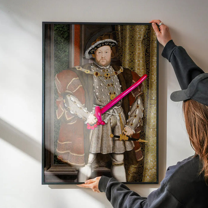 Henry VIII Balloon King Print being hung on a wall in a black frame