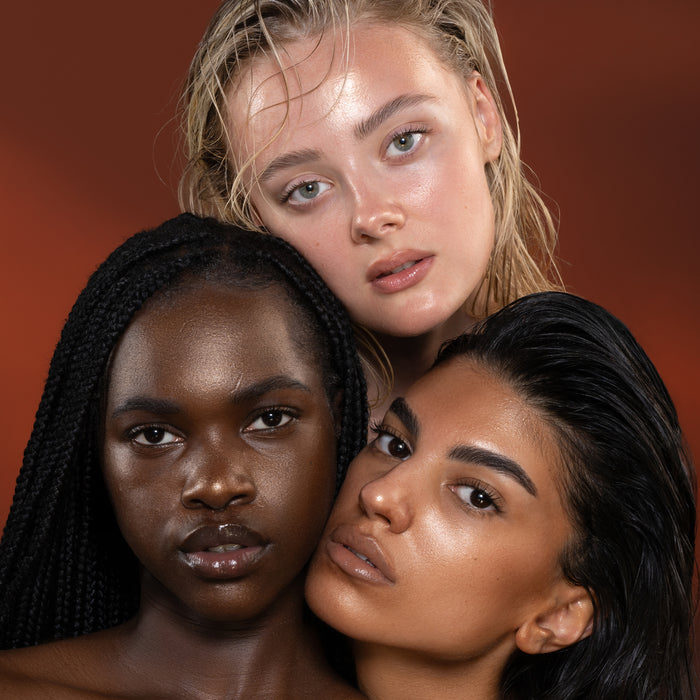 HY-GEN Bronze Primer Serum model looks with different skin tones on a brown background.