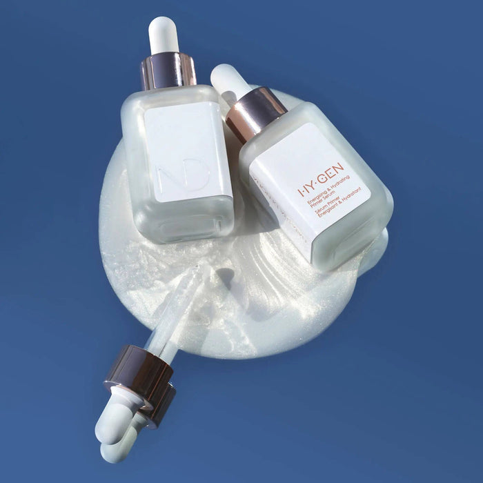 HY-GEN Original Primer Serum bottles and dropper on a blue background.