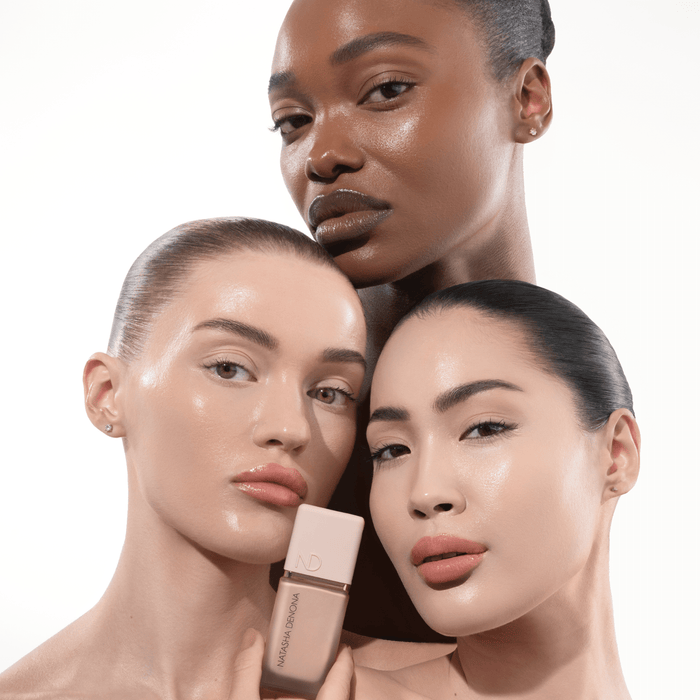 HY-GLAM Foundation model looks with different skin tones on a white background. One of the models is holding the product in her hand.