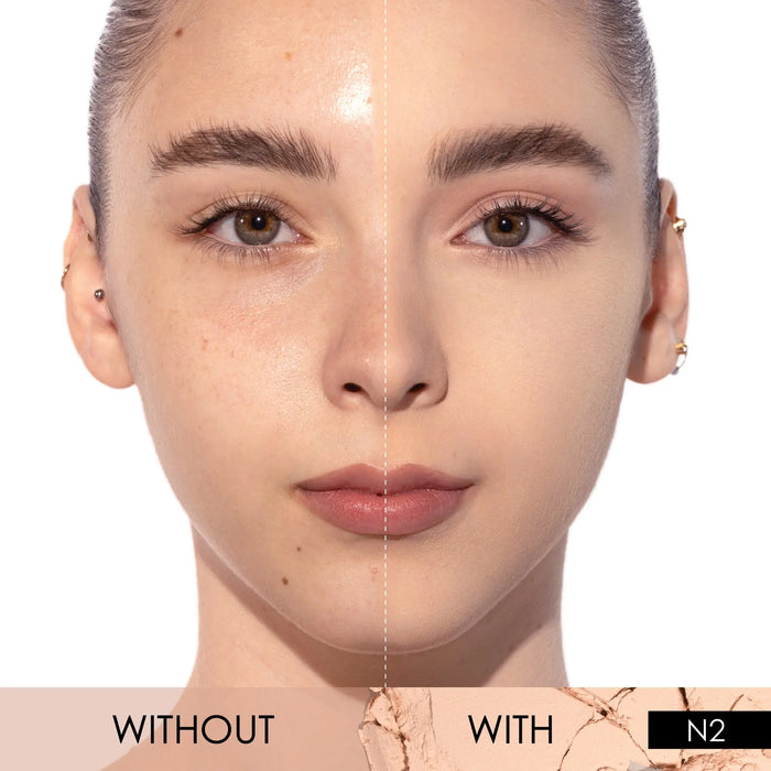 A split-screen with-and-without demonstration of the HY-GLAM Powder Foundation in shade N2 on a model's face.
