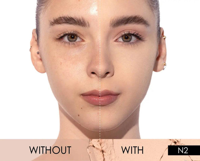With-and-without demonstration of HY-GLAM Powder Foundation in shade N2 on a model's face.