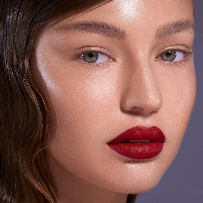 I Need a Rouge Lip Styletto model look on a dark gray background.