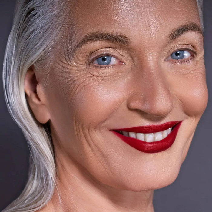 I Need a Rouge Lip Styletto model look on a dark gray background.