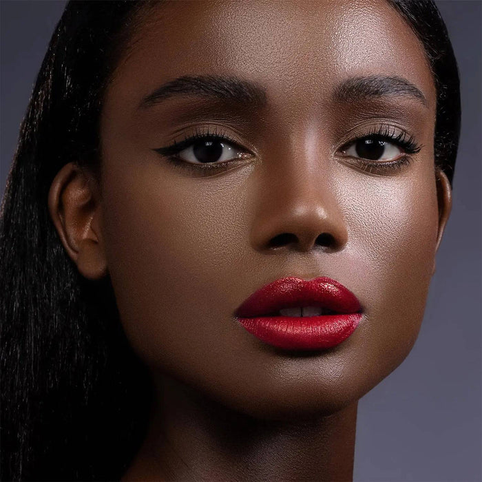 I Need a Rouge Lip Styletto model look on a dark gray background.