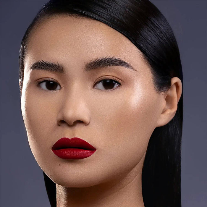 I Need a Rouge Lip Styletto model look on a dark gray background.