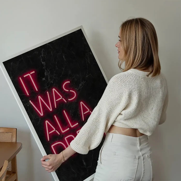 It Was All A Dream Neon Print held up against a living room wall
