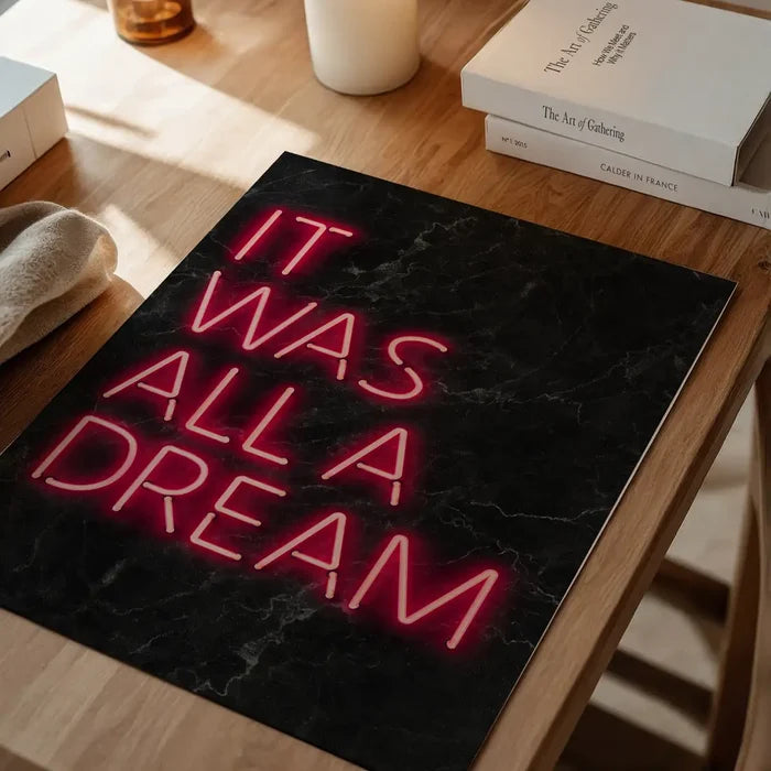It Was All A Dream Neon Print unframed on a home office desk