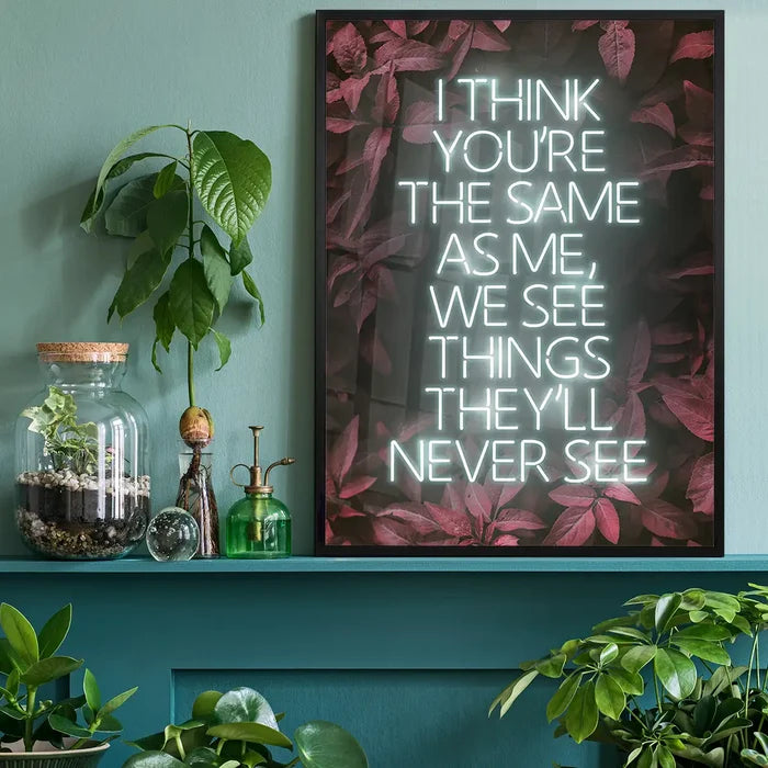 Live Forever Lyrics Print, music lyrics print black framed on a living room shelf
