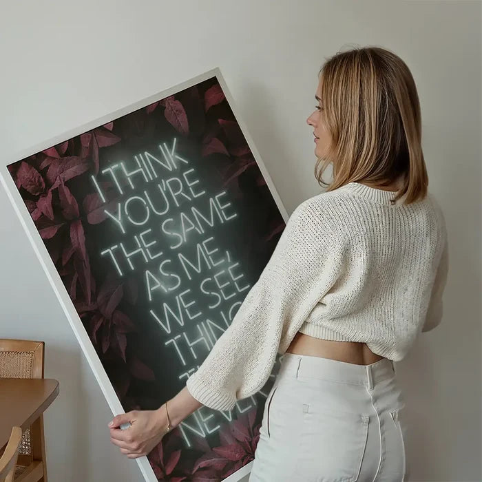 Live Forever Lyrics Print held up against a living room wall