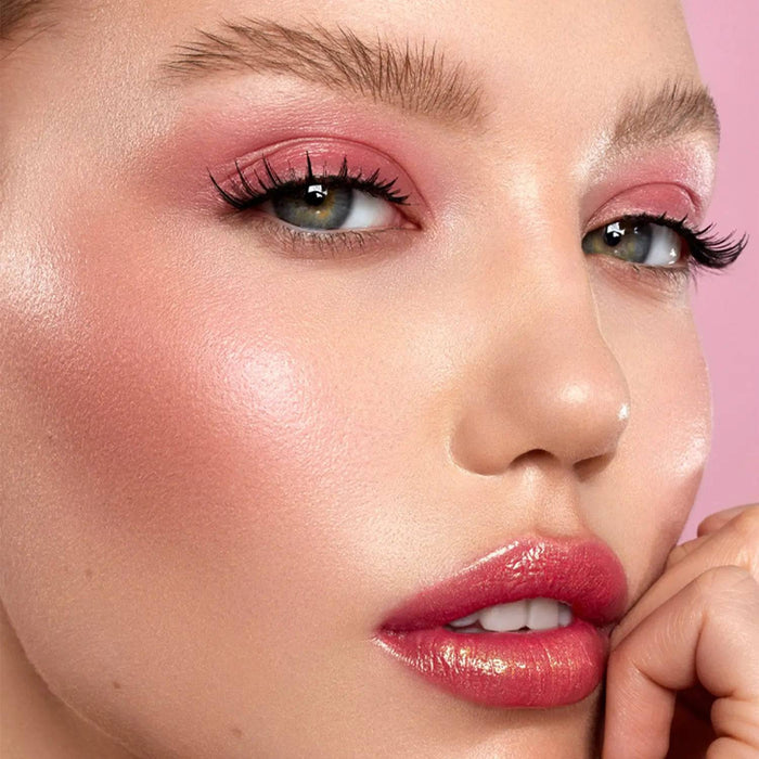 Love Glow Cheek Palette model look on a pink background.