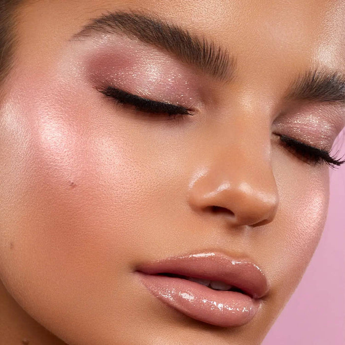 Love Glow Cheek Palette model look on a pink background.