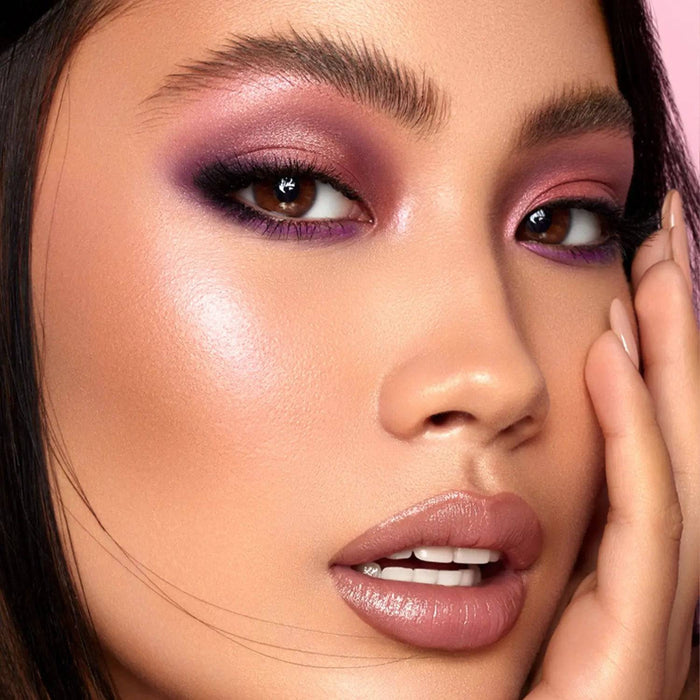 Love Glow Cheek Palette model look on a pink background.